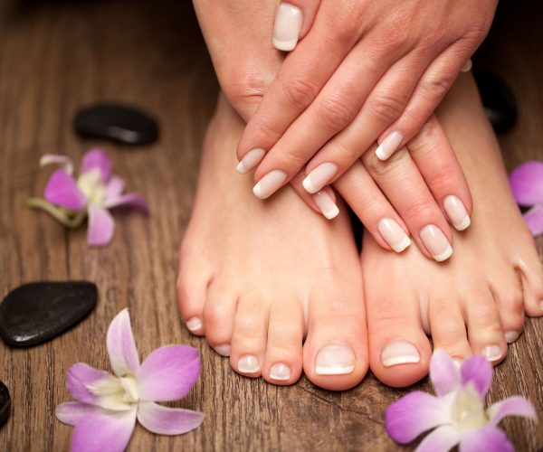 Relaxing-pink-manicure-and-pedicure-with-a-orchid-flower